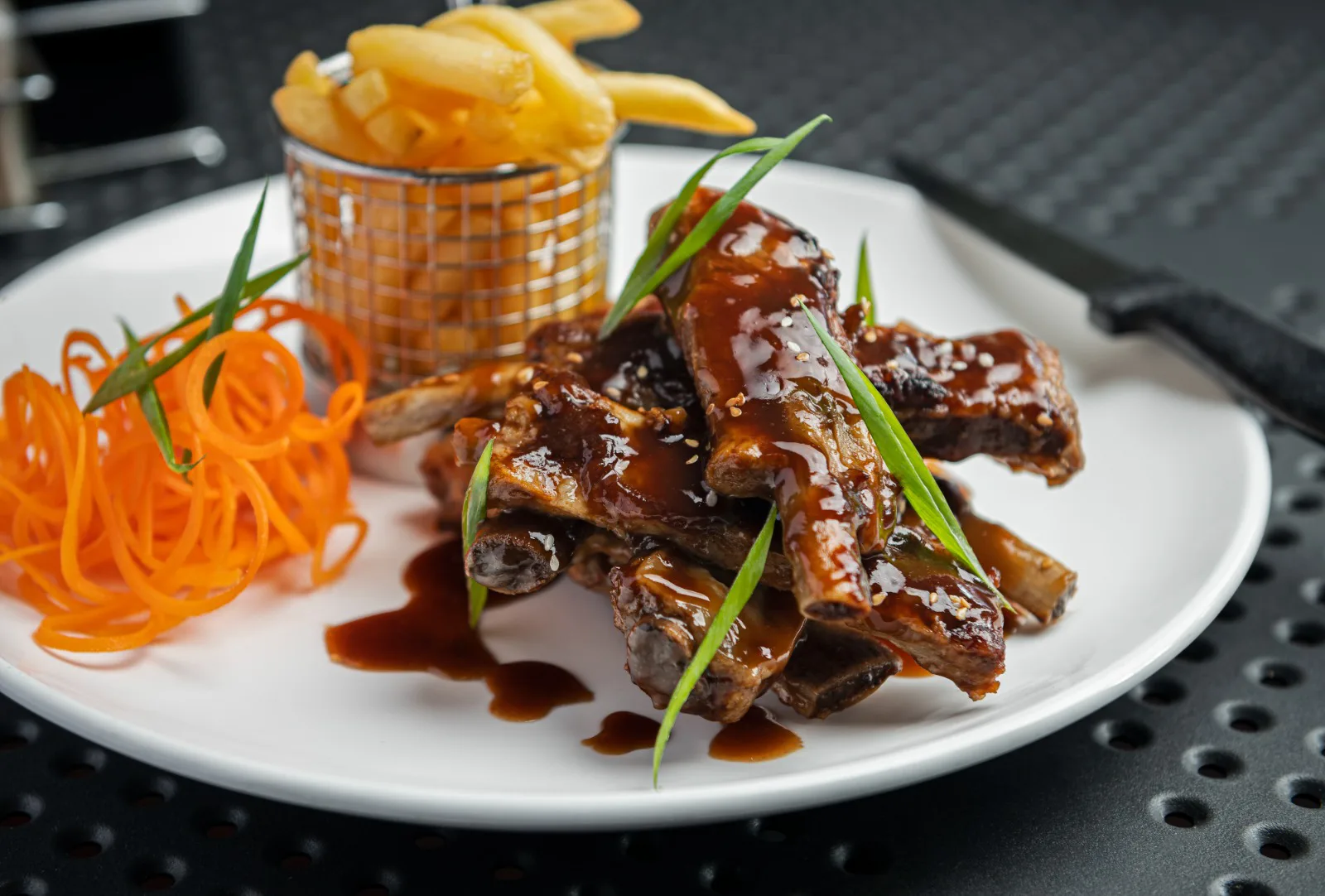 Glazed pork ribs with fries